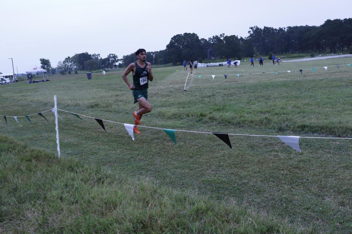 An Eagle runner competes in the Friday meet.
