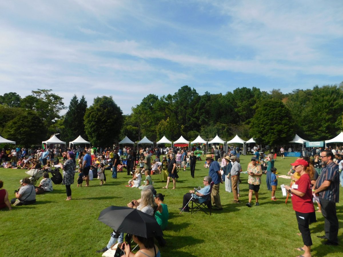 People watching a performance at the International Festival on Sunday, at the Botanical Garden of the Ozarks. 

