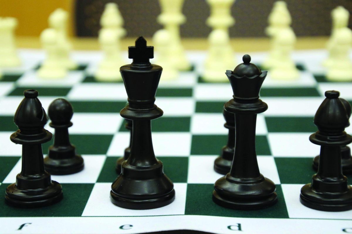A chess board is set up for play.
