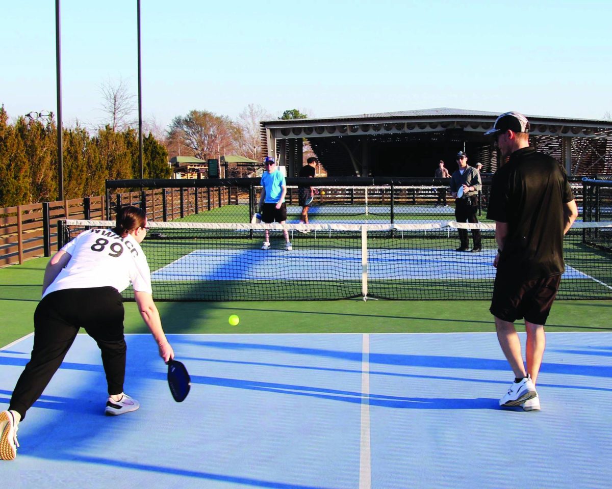 Four people play pickleball at a court in Bentonville.